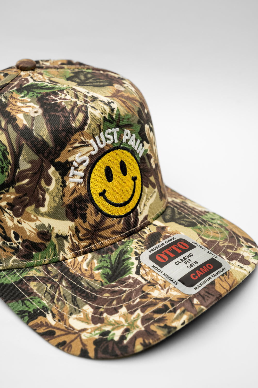 IT'S JUST PAIN CAMO HAT - GRIN & BEAR IT EDITION