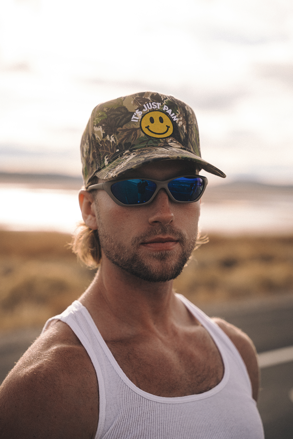 IT'S JUST PAIN CAMO HAT - GRIN & BEAR IT EDITION